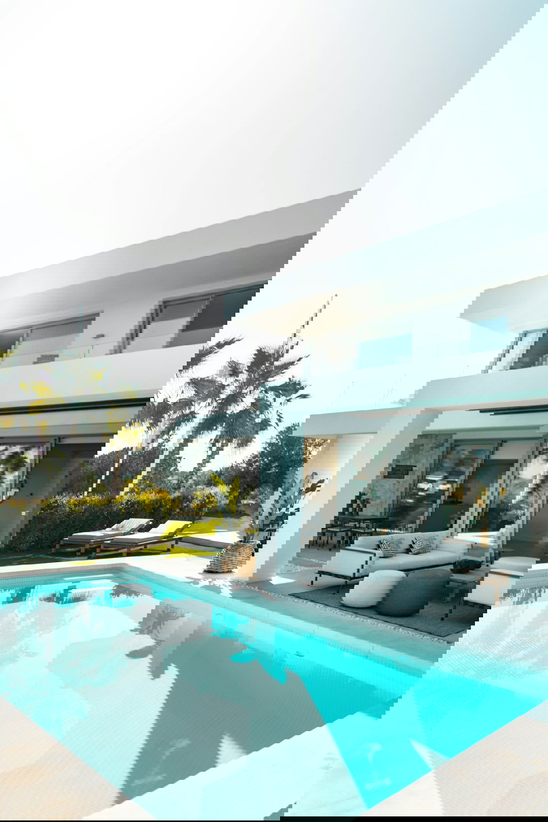 white concrete building with swimming pool